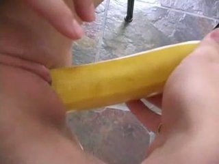 Shaved pussy having fun with a bannana Video