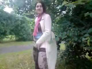 Depraved brunette milf in stockings pissing like a man outdoor